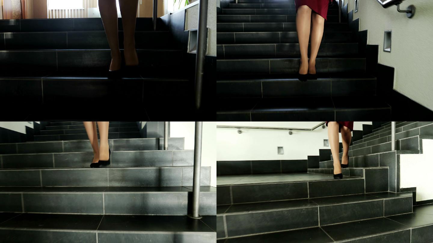 穿着高跟鞋的女商人走下楼梯。