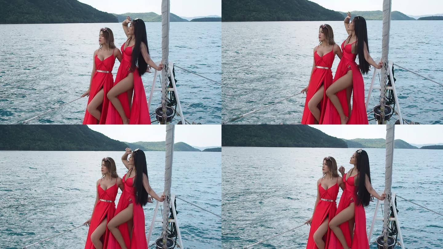 性感美女穿着红色连衣裙登上豪华游艇