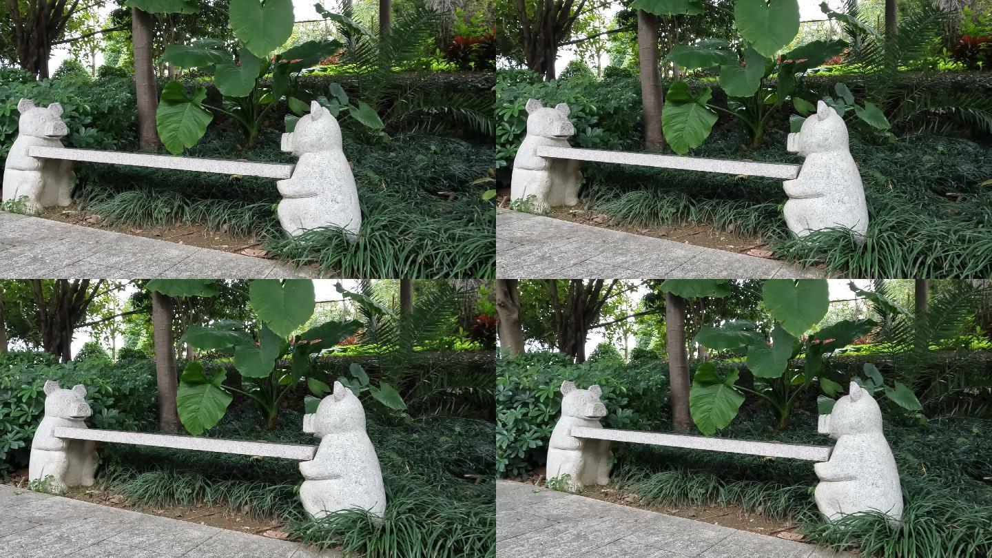 凤岭儿童公园阴生植物树荫下的小猪石凳