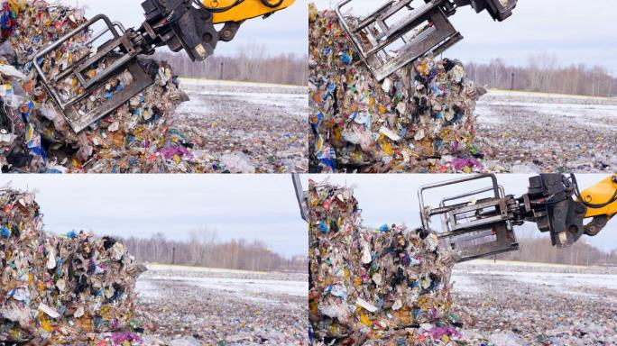 垃圾收集机在垃圾填埋场处理垃圾。
