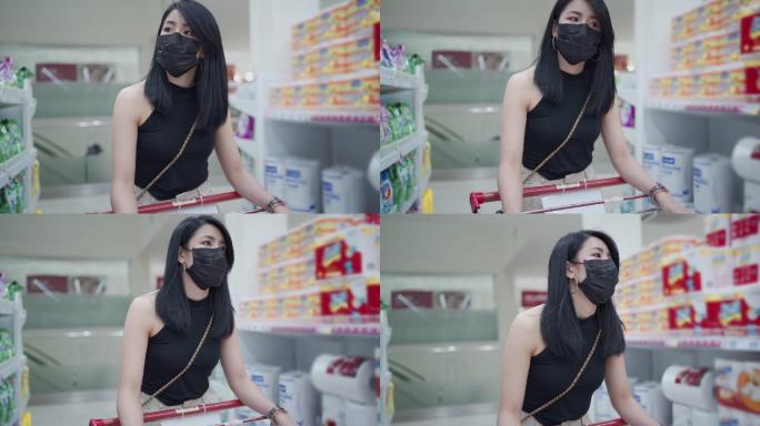 在超市购物的女孩疫情期间到超市采购戴口罩