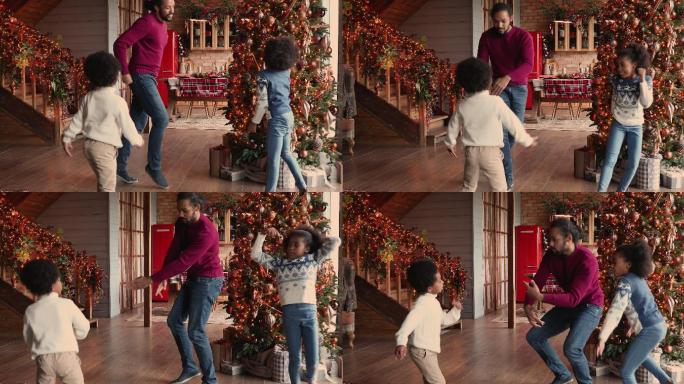 爸爸和儿子女儿共舞庆祝圣诞节