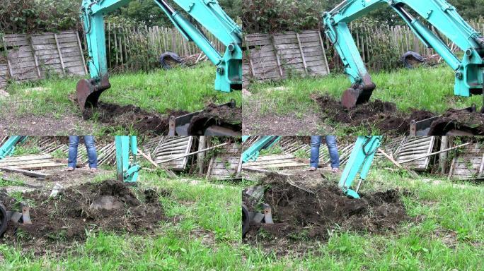 小型挖掘机在家庭花园中挖土