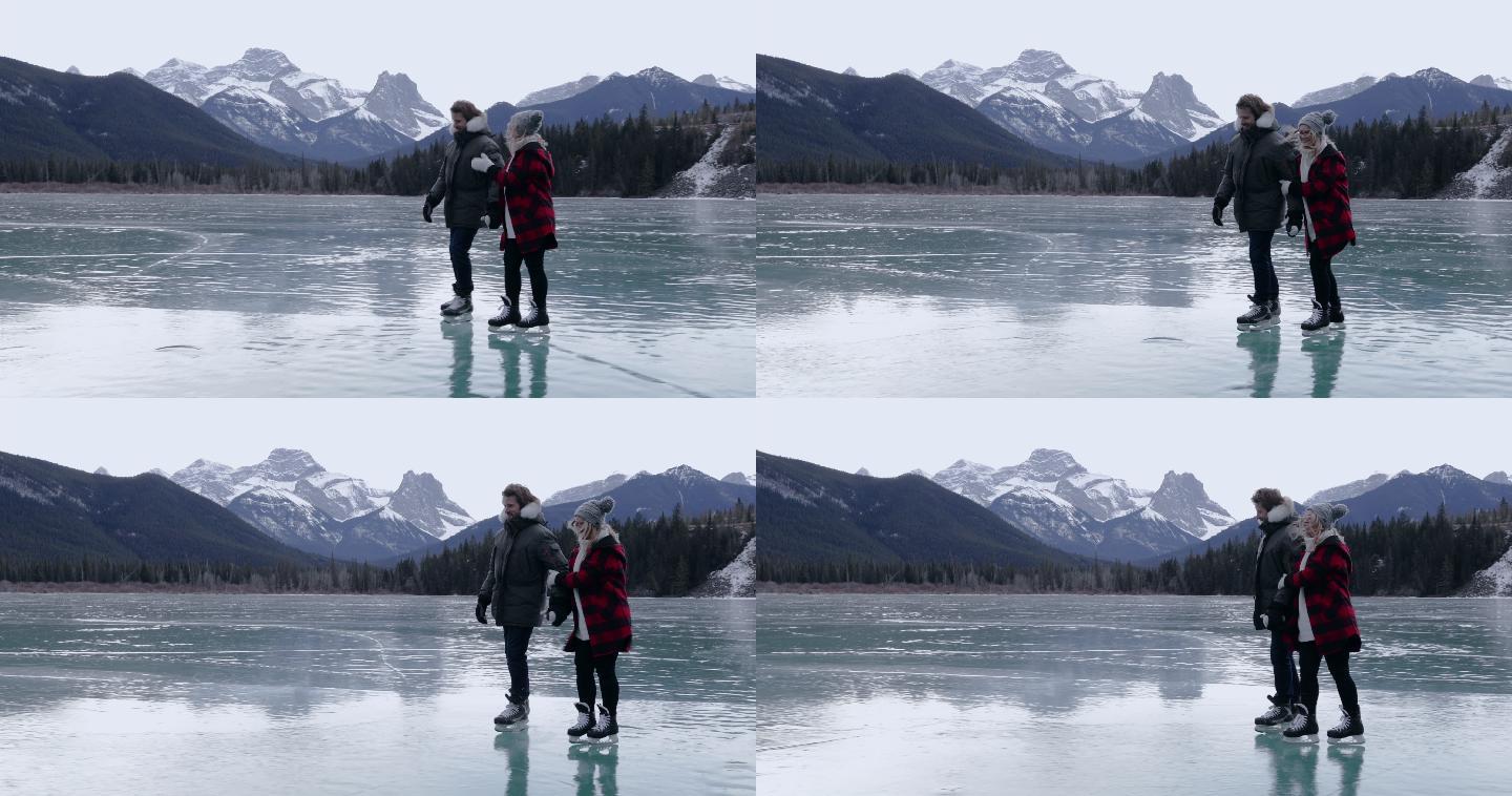 一对情侣在结冰的湖面上滑冰