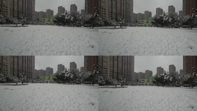 冬天冬季下大雪小区白雪下雪堆雪人场景场面