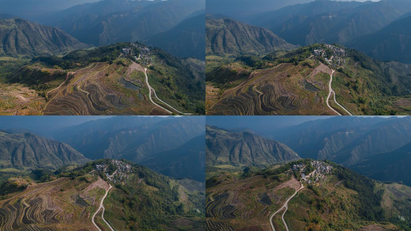 云南红河山顶哈尼村寨群山延绵和梯田全景