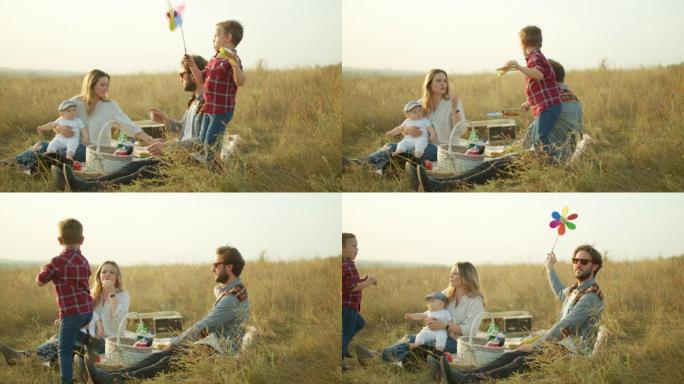 一家人在乡下的田野里野餐