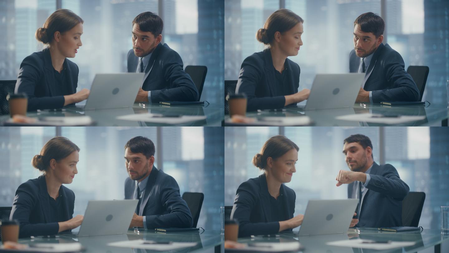 男女生在办公室的会议室里用笔记本电脑聊天