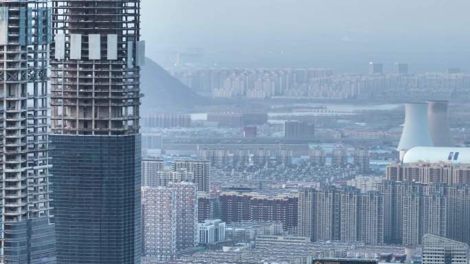 冬日暮色中航拍济南CBD处建设中的城市