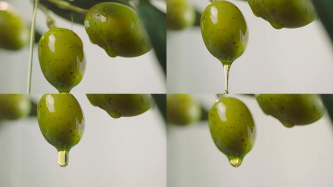 滴在生绿橄榄上的橄榄油。
