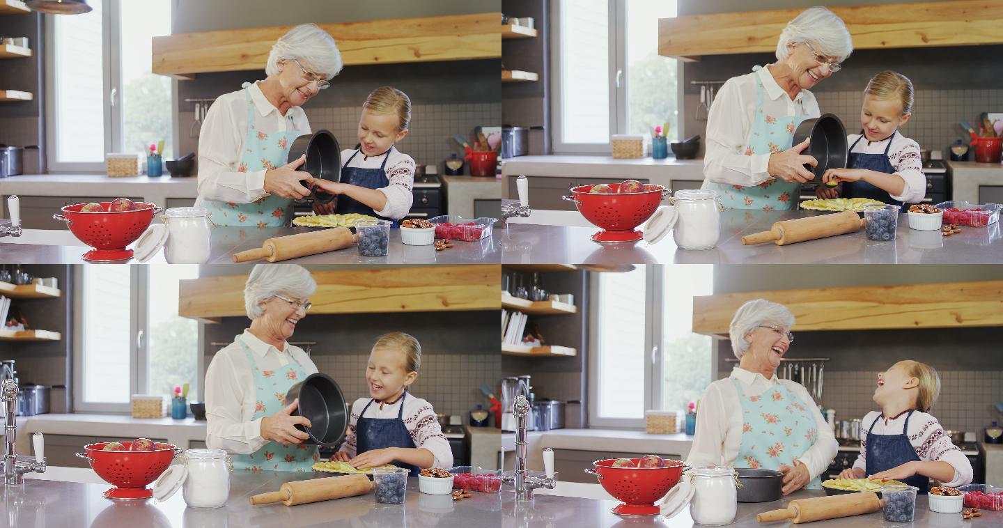 祖母和孙女正在准备馅饼