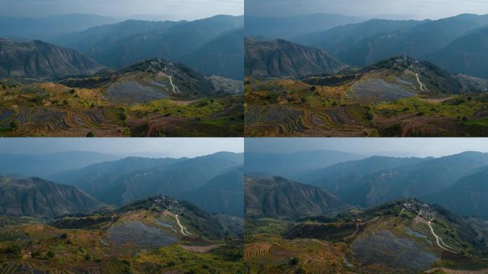 云南红河陡峭山顶哈尼村寨群山延绵梯田全景