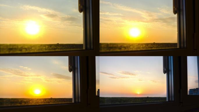 透过窗户看日落窗外流云太阳