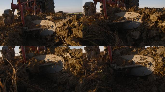一台犁在耕田的同时翻转土壤的上层