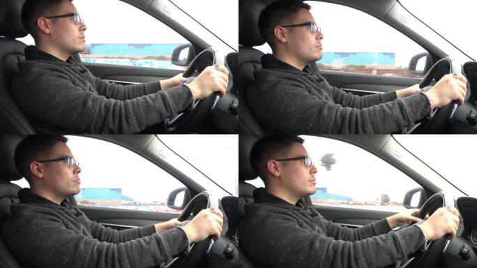 男子驾驶一辆汽车在高速公路上行驶