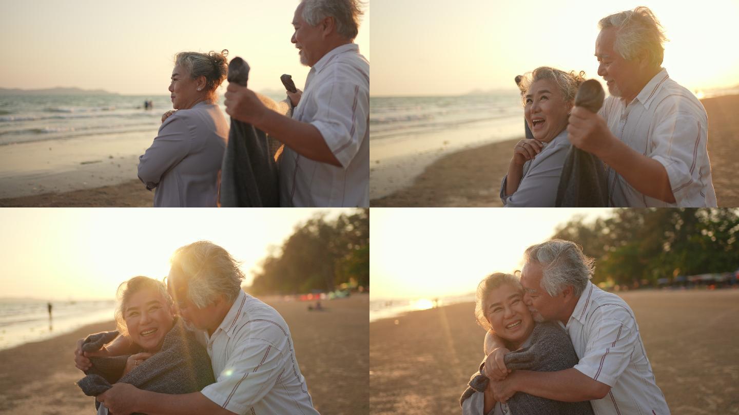 老年夫妇在海滩上享受浪漫假期