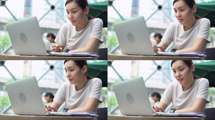 日本女子在咖啡馆使用笔记本电脑