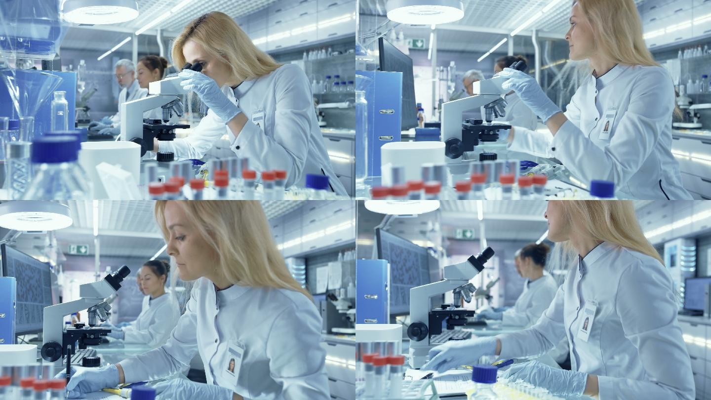 女研究科学家在显微镜下观察生物样本。