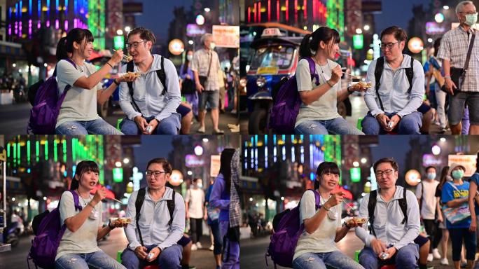 情侣在曼谷享受街头美食