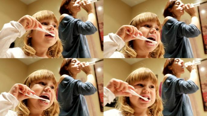 孩子和母亲刷牙特写镜头童真童趣电动牙刷