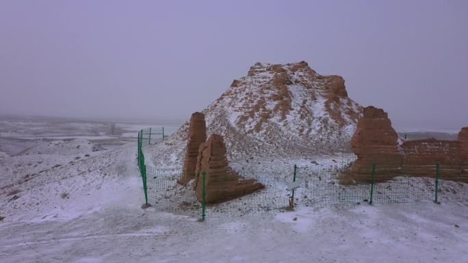 航拍阴雪天苍凉山岭烽燧遗址