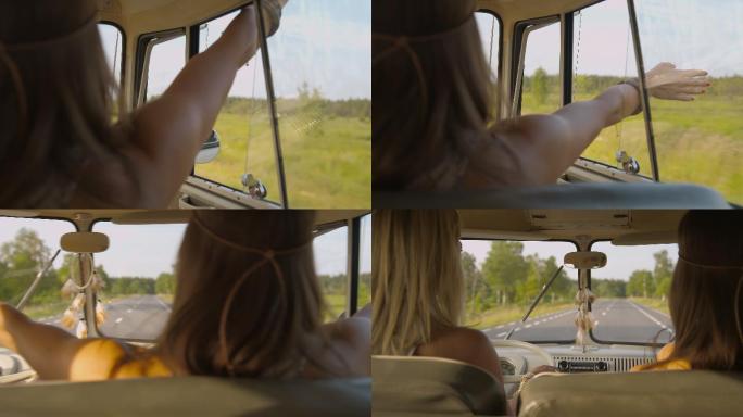 开车时，一名女子把手伸出窗外