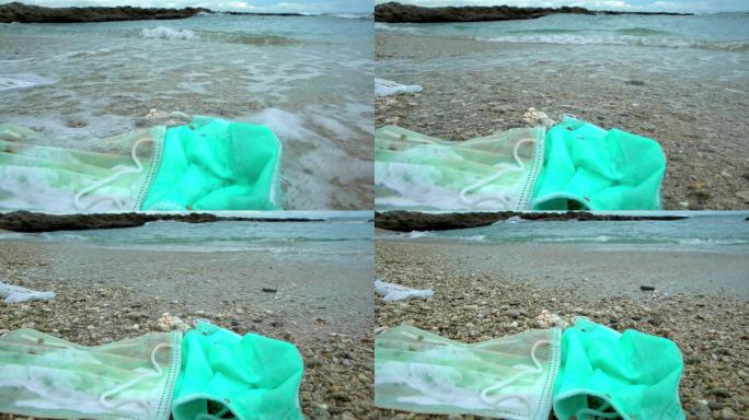 海滩上的一次性口罩