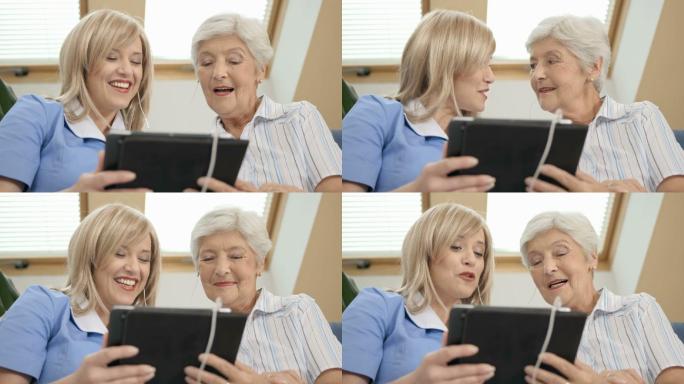 护士和老人用平板电脑唱歌