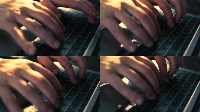 男人的手在笔记本电脑键盘上打字