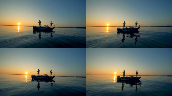 几个男人钓鱼的日出水景