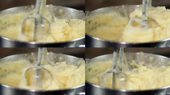 锅里的土豆泥用搅拌器搅拌。