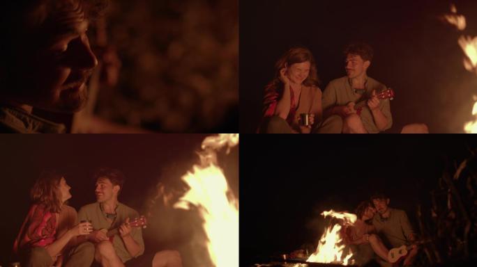 男子篝火旁为女友弹吉他