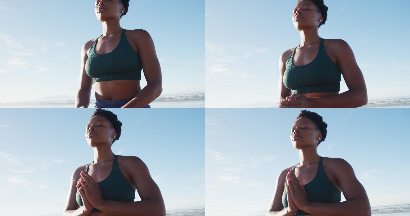 海边冥想的女人瑜伽运动健康生活公园锻炼