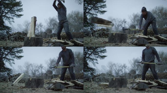 男子用斧头将一根木头劈成两半