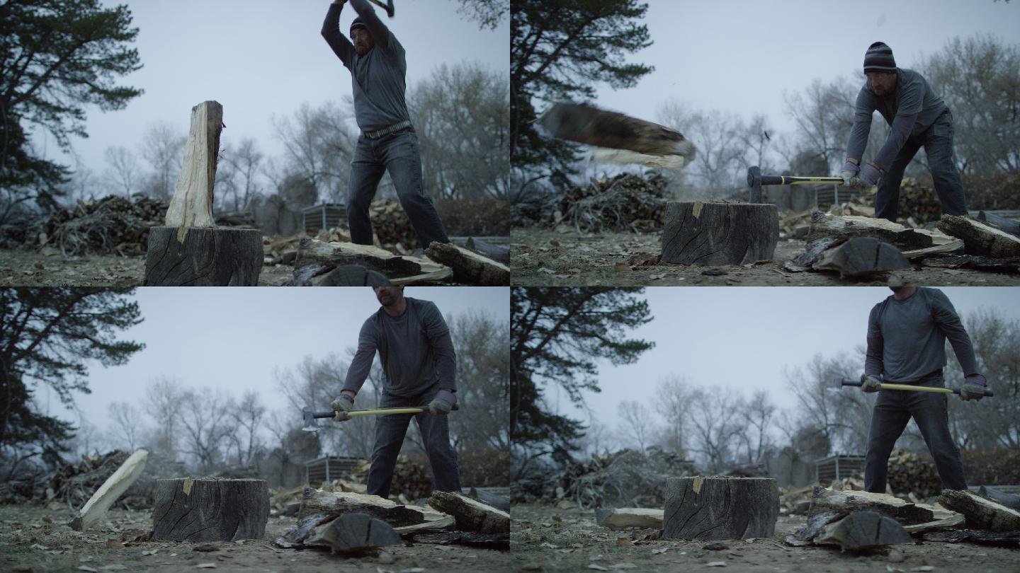 男子用斧头将一根木头劈成两半