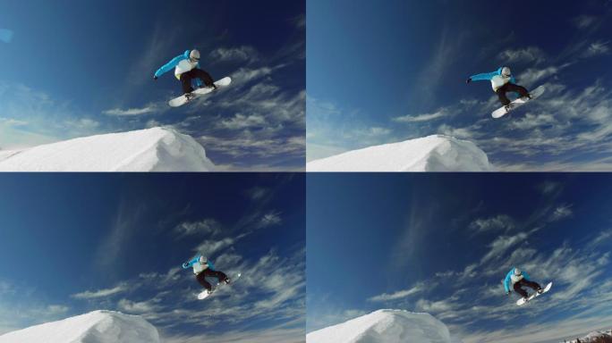 专业滑雪运动员跳过雪山的超慢镜头