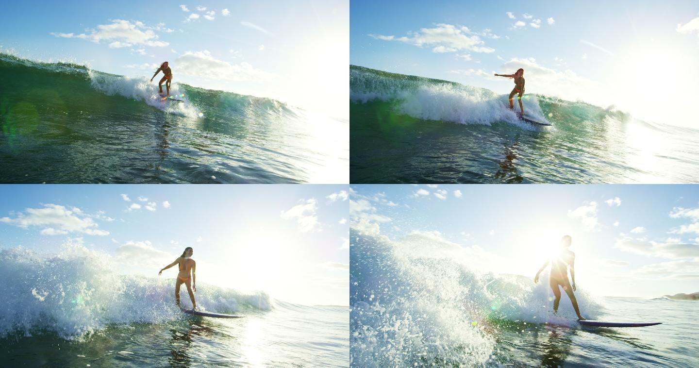 美丽的年轻女子在日落时冲浪