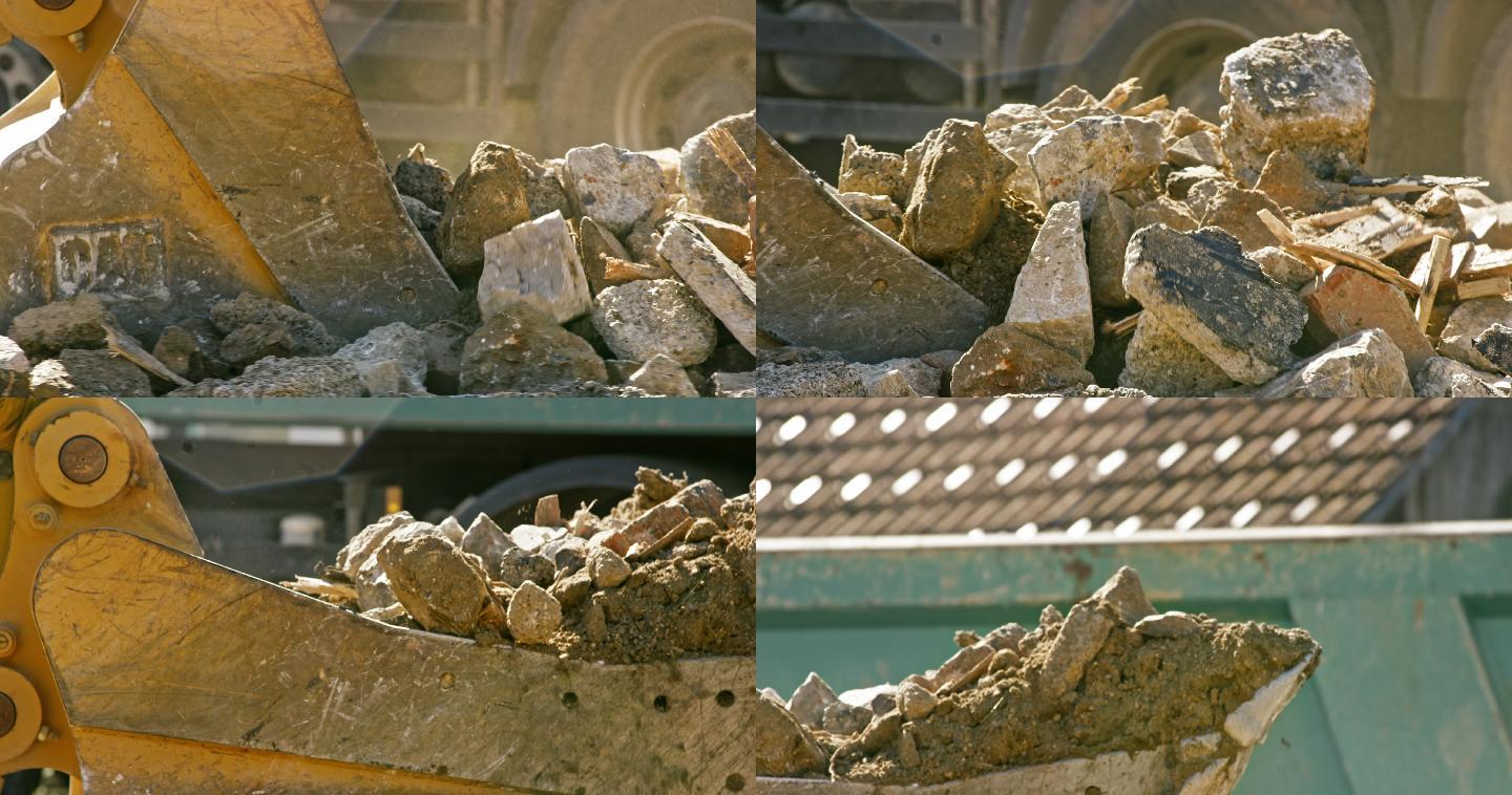 挖掘机铲斗在阳光下填充建筑垃圾