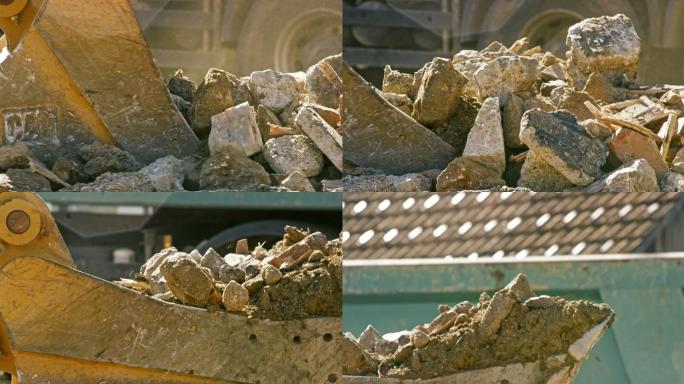 挖掘机铲斗在阳光下填充建筑垃圾