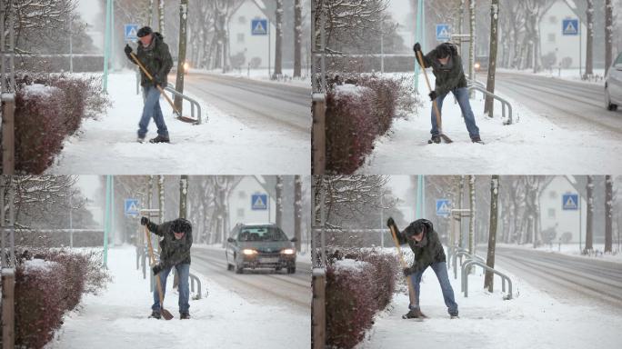 铲人行道上的积雪老人降雪雪中铲雪冬天来临