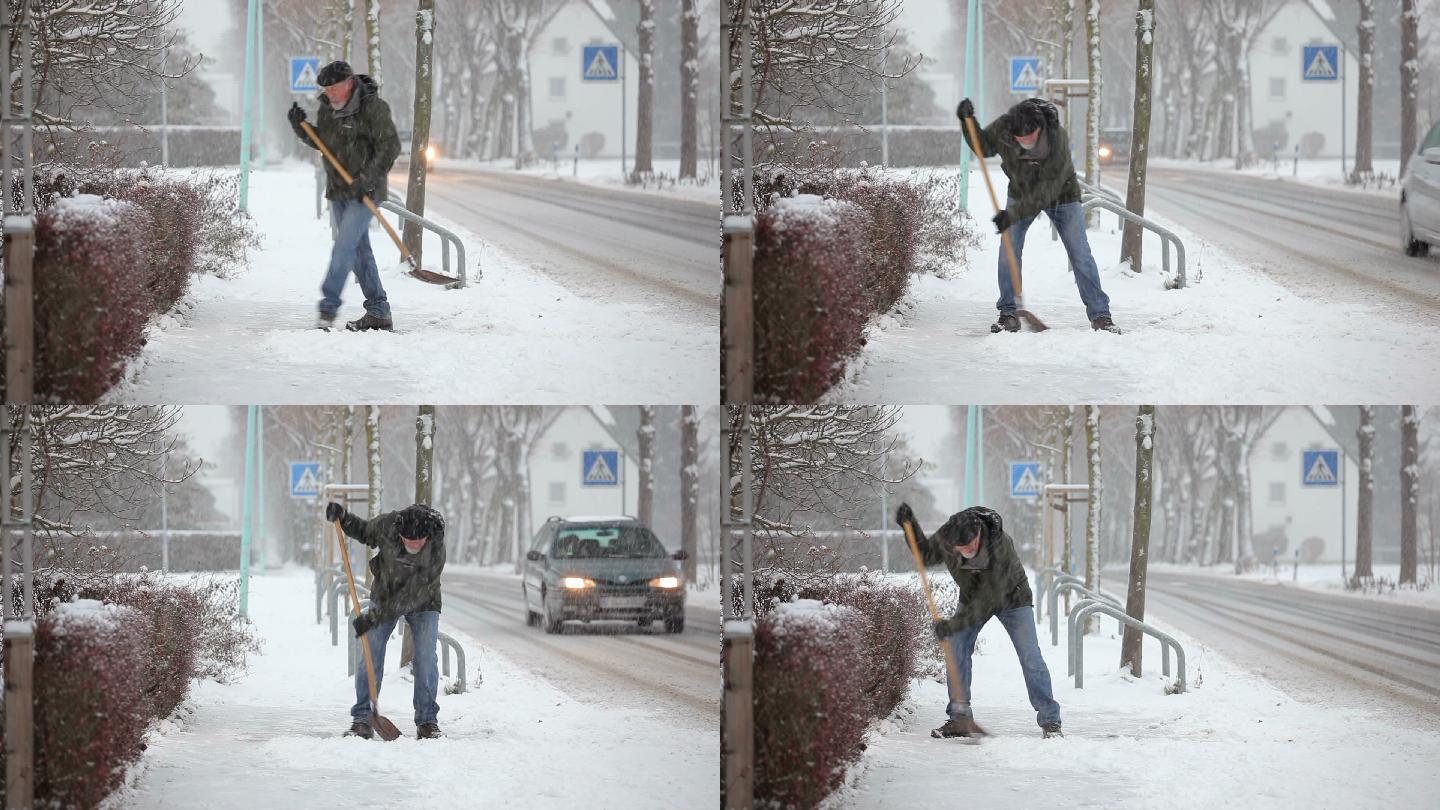 铲人行道上的积雪老人降雪雪中铲雪冬天来临