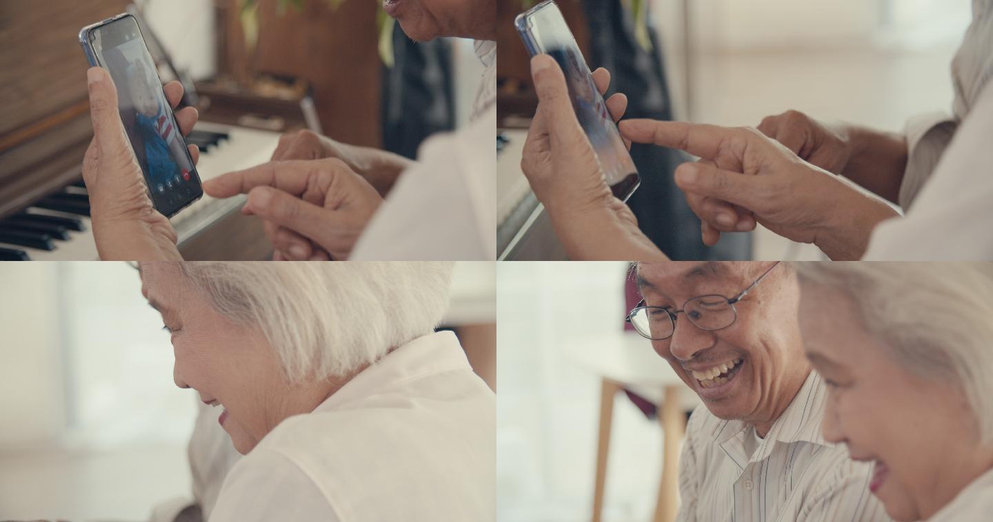 老年夫妇用智能手机与孙辈交谈