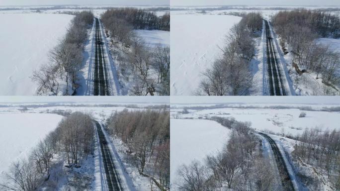 冬季航拍旅行在雪道路上