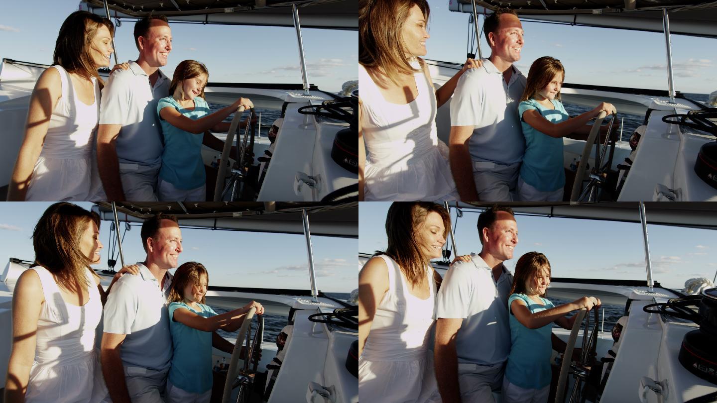 年轻的父母和女儿一起开游艇