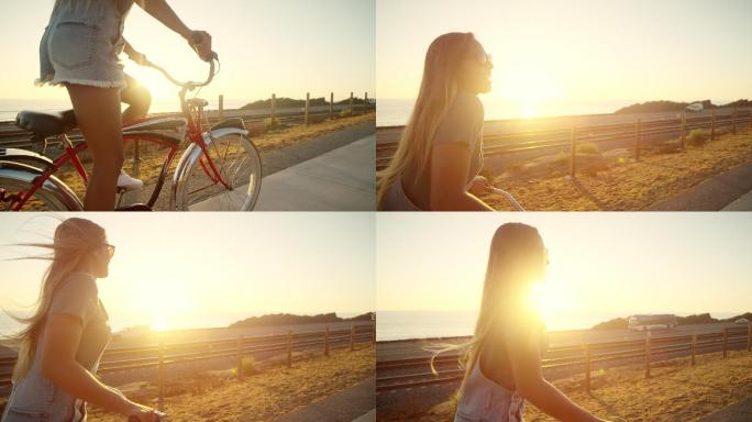 年轻女孩在日落时骑着自行车