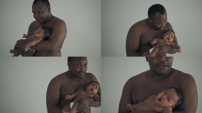 抱着孩子的男人非洲黑人小孩出生婴幼儿