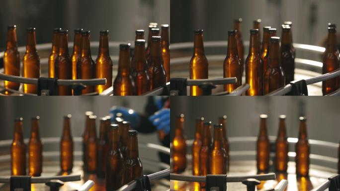 在一家啤酒厂的自动机器上安装瓶子