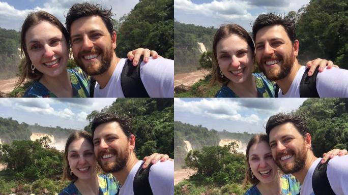 情侣在伊瓜苏瀑布自拍时玩得很开心
