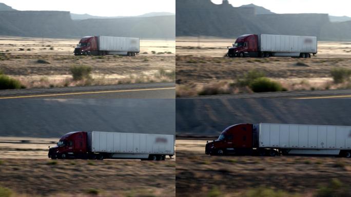 半卡车沿着沙漠中的四车道公路行驶