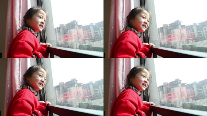 小女孩望向窗外的样子